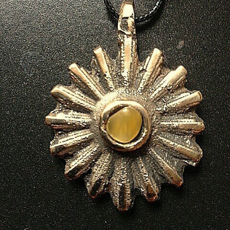 brass medallion Sun