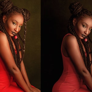 May include: A woman with long, dark braids wears a red sleeveless dress. She has dark makeup and a cherry-red accessory on her lip.