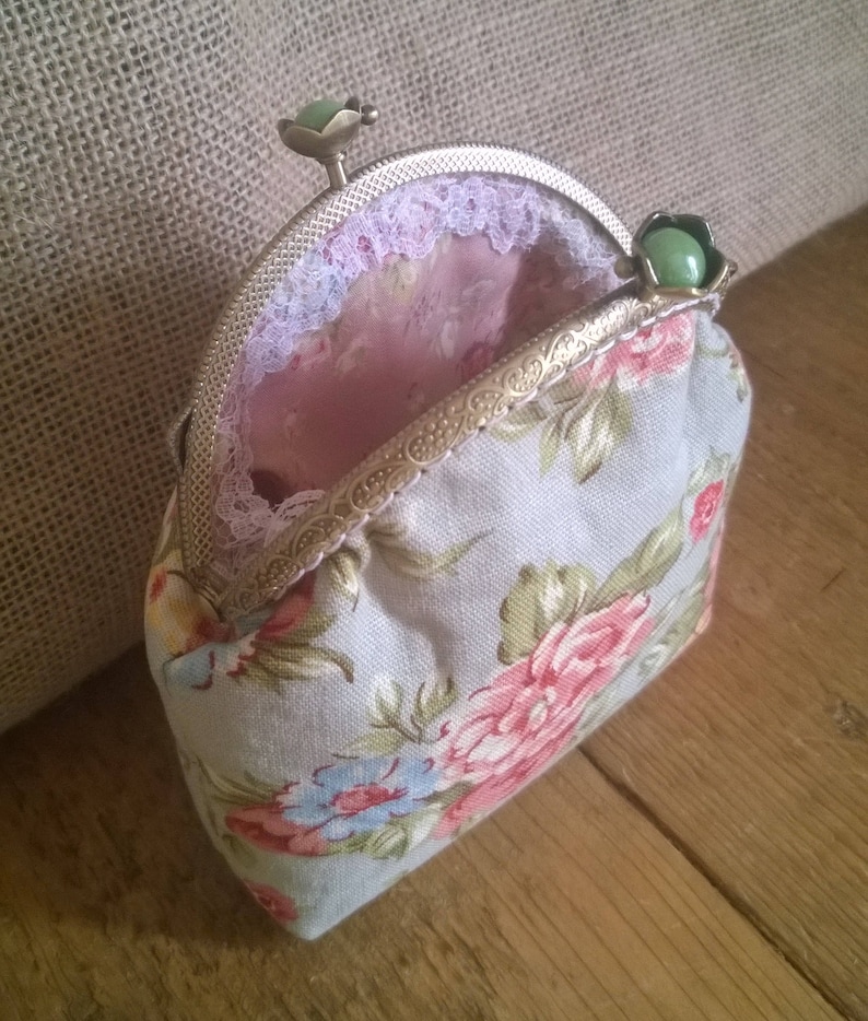 Purse with flower detail. with added lace detail Hand Made coin purse made with a sew in purse frame