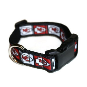 May include: Black dog collar with a red and white Kansas City Chiefs logo pattern.