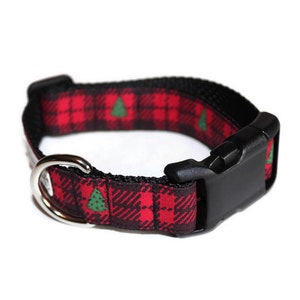 May include: A red and black tartan dog collar with a green Christmas tree pattern and a black plastic buckle.