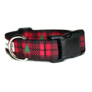 May include: Red and black tartan dog collar with a green Christmas tree pattern and a black plastic buckle.
