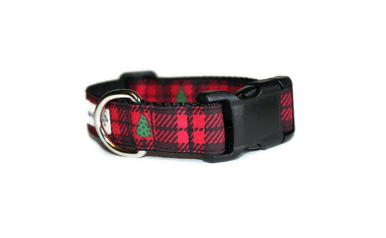 May include: Red and black tartan dog collar with a green Christmas tree pattern and a black plastic buckle.
