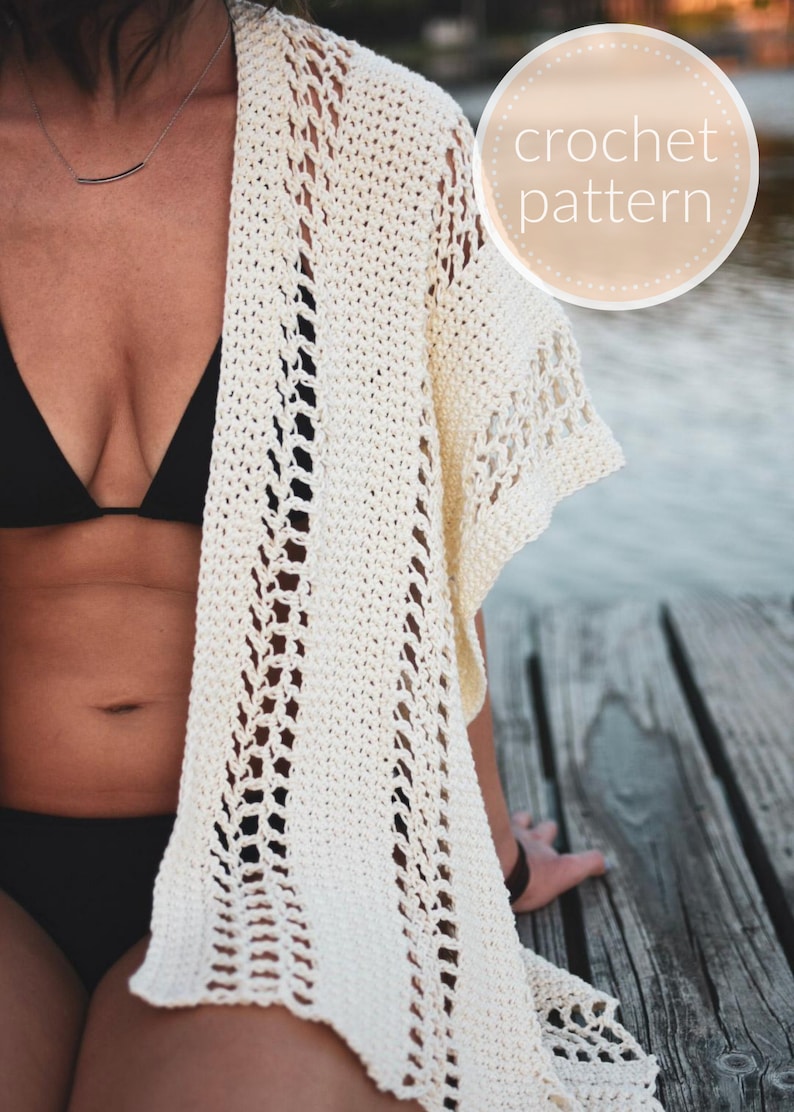May include: A white crochet cover-up with a lacy pattern. The cover-up is worn over a black swimsuit. The image includes the text "crochet pattern".
