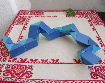 Quebra-cabeça de cobra de Rubik vintage: brinquedo lógico 3D flexível