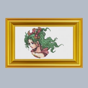 Könnte beinhalten: Kreuzstichmuster einer Frau mit grünen Haaren und einer rosa Blumenkrone, gerahmt in einem goldenen Rahmen.