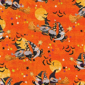 May include: Orange fabric with a Halloween theme. The design features gnomes riding brooms, bats, stars, and moons. The gnomes wear pointed hats and have long beards. The fabric is suitable for crafting or seasonal decor.