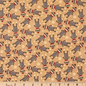 May include: A beige fabric with a repeating pattern of gray sock monkeys. The monkeys are wearing red and white striped socks and have black eyes and mouths. The fabric has a subtle ribbed texture.