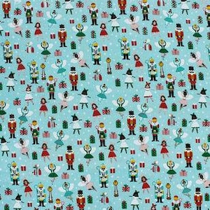 May include: A teal blue fabric with a repeating pattern of a Nutcracker, a ballerina, a Christmas tree, a gift box, and snowflakes.
