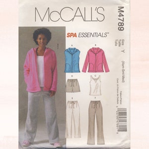 May include: McCall's M4789 sewing pattern for a women's clothing set. The pattern includes a pink hooded jacket, a blue vest, a pink jacket, a pair of beige shorts, a white tank top, a pair of beige trousers, and a pair of white trousers. The pattern is for sizes X-Small, Small, and Medium.