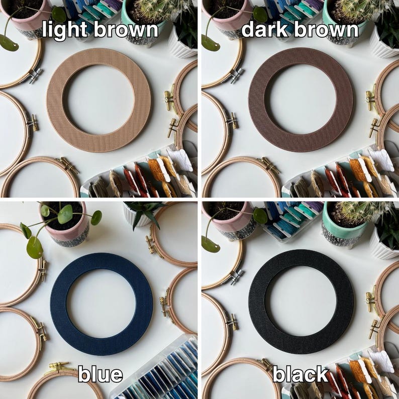 May include: Four embroidery hoops with different colored fabric inserts. The hoops are arranged in a square with the fabric inserts facing the camera. The colors of the fabric inserts are light brown, dark brown, blue, and black. The hoops are surrounded by embroidery floss and other crafting supplies.