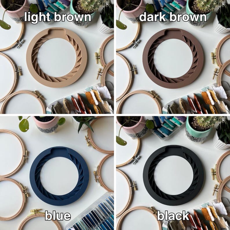 May include: Four embroidery hoops with different colored silicone inserts. The colors are light brown, dark brown, blue, and black. The hoops are on a white surface with other craft supplies.