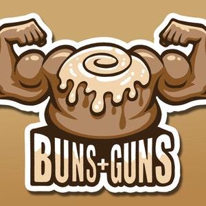 May include: A cartoon illustration of a cinnamon bun with arms flexed, showing off its muscles. The bun is brown with white icing and a swirl on top. The text "BUNS+GUNS" is written below the bun.