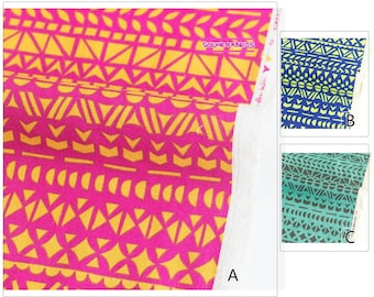 May include: Three fabric swatches with geometric patterns. The first swatch is pink with yellow geometric shapes. The second swatch is blue with yellow and green geometric shapes. The third swatch is teal with black geometric shapes. The text "SOUHE FABRICS" is visible on the first swatch.