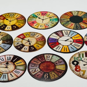 May include: A collection of colorful, vintage-style clock faces with Roman and Arabic numerals. The clocks feature various color schemes, including red, yellow, blue, and green, with black clock hands. The clocks are arranged on a white surface.