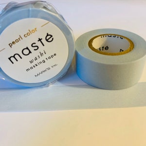 May include: Two rolls of light blue washi tape with the text "maste washi masking tape MARK'S Inc." on the label. The tape is labeled "pearl color".