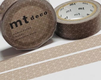 May include: Two rolls of decorative washi tape with geometric patterns. One roll is wrapped in clear plastic. The tape is brown with a light beige geometric design. The text "mt deco" and "KAMOI PAPER WASHI ADHESIVE TAPE" are visible on the roll.