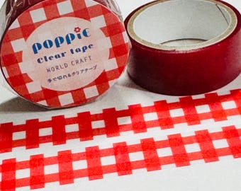 May include: Two rolls of adhesive tape with a red and white gingham pattern. One roll is wrapped in plastic packaging featuring the text Poppie clear tape WORLD CRAFT and Japanese characters. A strip of the red and white checkered tape is unrolled below.