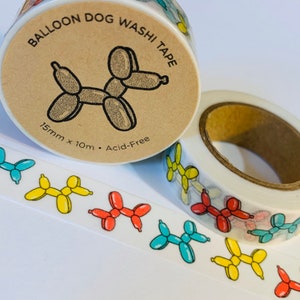 May include: A roll of washi tape with a repeating pattern of colorful balloon dog illustrations. The tape is 15mm wide and 10m long. The tape is acid-free. The label on the roll says "Balloon Dog Washi Tape".