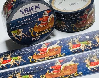 May include: Two rolls of masking tape with a Christmas theme. The tape is dark blue with a repeating pattern of Santa Claus in a sleigh pulled by reindeer. The text "SAIEN masking tape" and "Merry Christmas" are also visible.