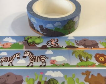 May include: A roll of blue washi tape with a cartoon animal design. The tape features illustrations of a hippo, monkey, zebra, lion, and other animals. The tape is on a white surface.