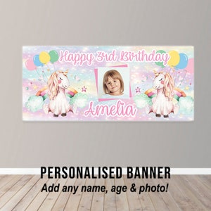 May include: A personalised unicorn birthday banner in pink, blue and white. The banner features a unicorn, rainbows, stars and balloons. It says "Happy 3rd Birthday Amelia".