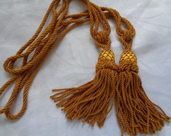 Two classic style curtain tiebacks with tassels, golden mustard tassel rope curtain tie backs
