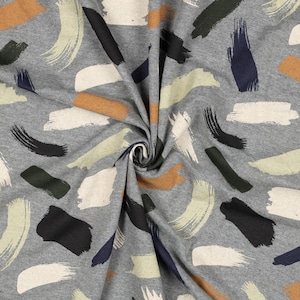May include: Grey fabric with a repeating pattern of abstract brushstrokes in beige, brown, dark green, black, and navy blue.