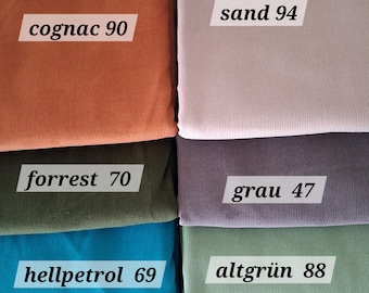 May include: A collection of eight folded fabric swatches featuring a ribbed texture. The colors include cognac 90, sand 94, forrest 70, grau 47, hellpetrol 69, altgrün 88, lila 84, and indigoblau 81, each labeled with its respective name and number.