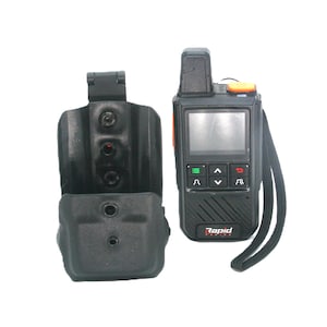 May include: Black and orange handheld radio with a screen and buttons, next to a black holster. The radio has the word "Rapid" printed on it. The holster has three visible rivets.