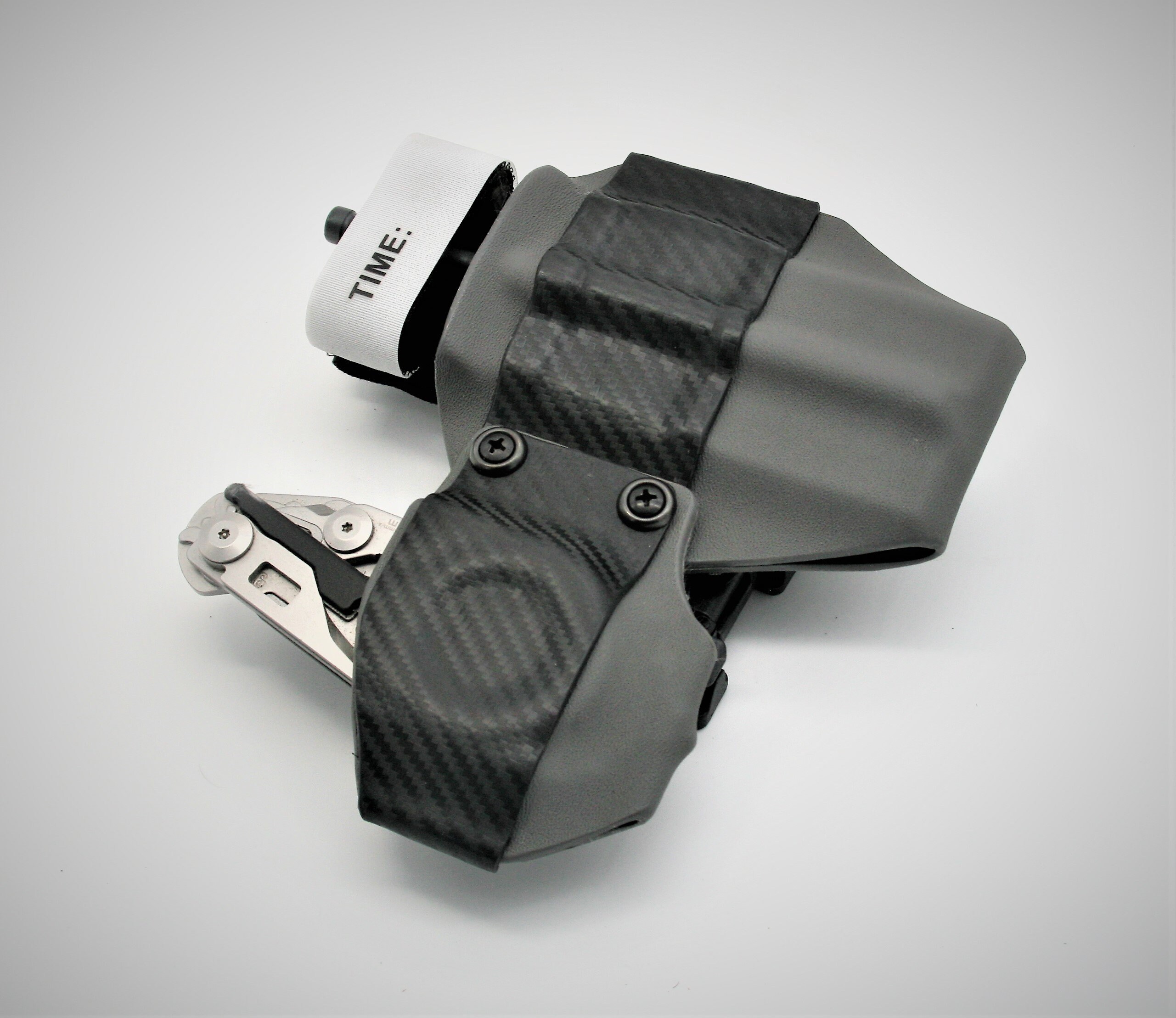 ETS Holster-CAT tourniquet retention lock with leather-man raptor