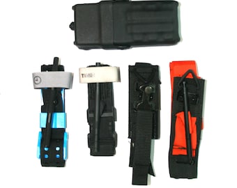 May include: A set of five black and orange medical tourniquets with a black pouch. The tourniquets have a black strap with a buckle and a red strap with a hook. The pouch has a black zipper and a black strap.