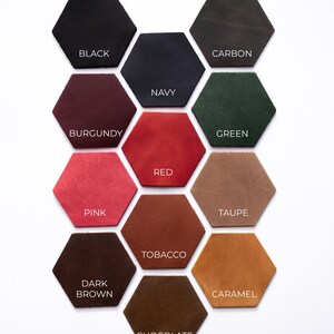 May include: Leather swatches in various colors, including black, navy, burgundy, red, pink, taupe, tobacco, dark brown, caramel, and chocolate. The swatches are arranged in a honeycomb pattern.