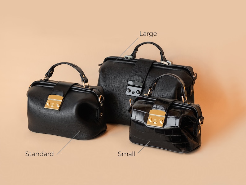 May include: Three black leather doctor bags in different sizes. The largest bag is labeled "Large", the middle bag is labeled "Standard", and the smallest bag is labeled "Small".