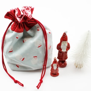 Weihnachtssäckchen/Geschenkverpackung Nikoläuse zartes hellblau/rot