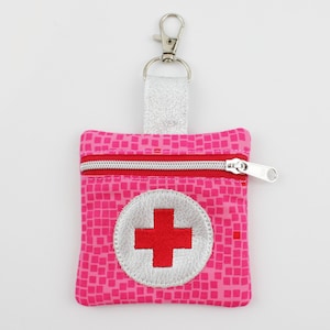 Mini kit di pronto soccorso 8 x 8 cm, fantasia grafica rosa/rosso