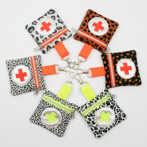 Mini borsa di pronto soccorso 8 x 8 cm con diversi disegni Leo tra cui scegliere