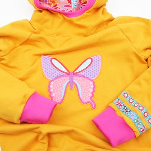 Kapuzenpulli Gr. 98-128 Schmetterling senfgelb/pink Bild 2