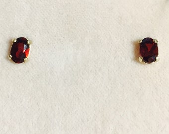 January birthstone is Garnet and these 6x4 oval earrings are set in solid 14 karat gold setting  Free Shipping