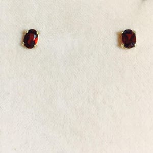 Garnet is a birthstone for the month of January. This pair of 6x4 oval Garnet earrings are set in solid 14 karat gold setting  app .95 Ct nice garnets