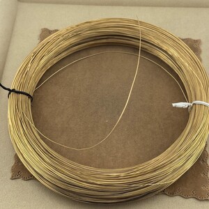 14K Yellow Gold Filled Round Wire 24 Gauge Wire Gold Filled Round Wire Soft 14/20GF 0.020th for beading and enameling sold in 60 inch lengths  24 Gauge Wire 14K Yellow Gold Filled Round Wire sold in 5 foot length. Soft great for pearl necklace and bracelet strands, beading, tying pig tails, fishing lures, enameling, etc…. 14/20GF 0.020 thousandths wire is semi finished just run through a jewelers cloth to polish.  5 feet weight is 2.85 grams. for repairs, jump rings (just use a 10 Penny nail).