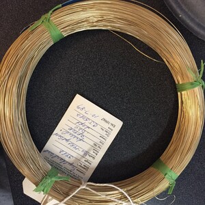 Soft great for pearl necklace and bracelet strands, beading, tying pig tails, fishing lures, enameling, etc…. 14/20GF 0.020 thousandths wire is semi finished just run through a jewelers cloth to polish.  5 feet weight is 2.85 grams.
for repairs, jump rings (just use a 10 Penny nail).