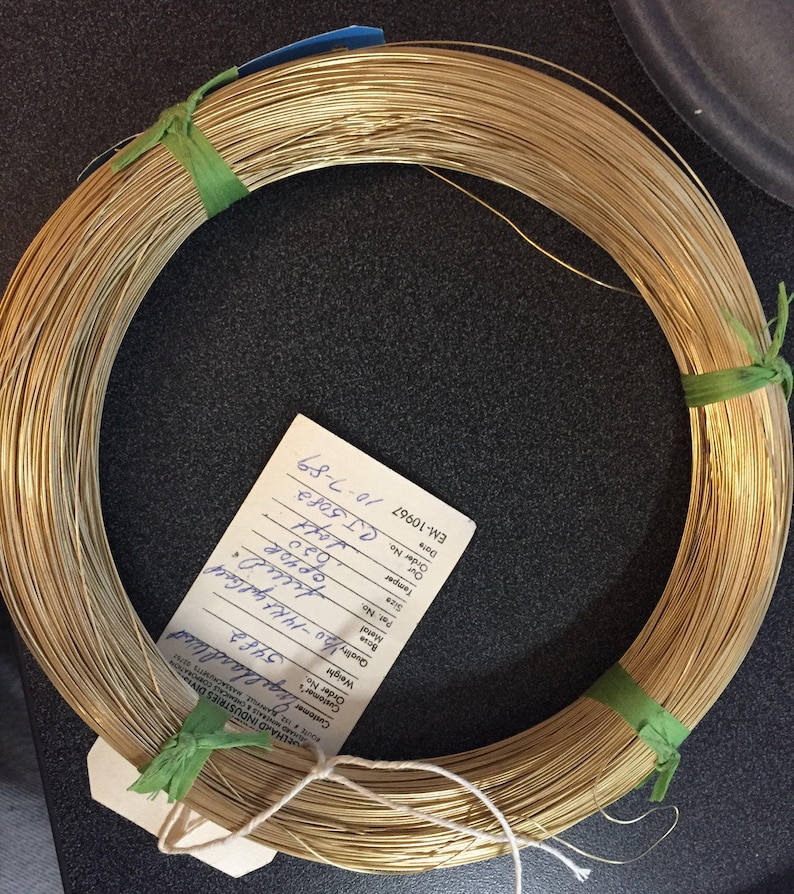 Soft great for pearl necklace and bracelet strands, beading, tying pig tails, fishing lures, enameling, etc…. 14/20GF 0.020 thousandths wire is semi finished just run through a jewelers cloth to polish.  5 feet weight is 2.85 grams.
for repairs, jump rings (just use a 10 Penny nail).
