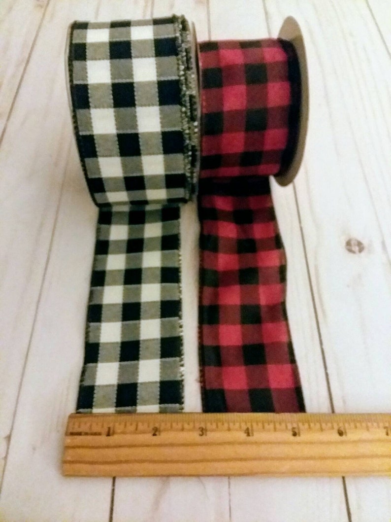 May include: Two rolls of plaid ribbon, one black and white, and one red and black. The ribbon is 2.5 inches wide.