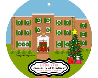 May include: Round Christmas ornament featuring a building decorated with wreaths and green shutters. A Christmas tree with a star and presents is on the right. The ornament has the text "Delta Zeta University of Kentucky Alpha Theta Chapter."