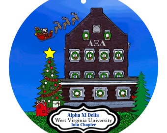 May include: A round Christmas ornament featuring a brick building with wreaths in the windows and the Greek letters ΑΞΔ. Santa Claus in a sleigh is pulled by reindeer above the building. A Christmas tree and gifts are in the foreground. The text reads "Alpha Xi Delta, West Virginia University, Iota Chapter."