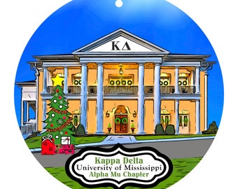 May include: A round Christmas ornament featuring a detailed illustration of a building with columns, a Christmas tree, and the text "Kappa Delta University of Mississippi Alpha Mu Chapter". The ornament has a blue sky background.