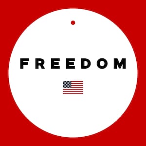 May include: A white circular ornament with the word "FREEDOM" in bold black letters. Below the word is a small American flag. The background is red, with a small red dot at the top of the ornament.