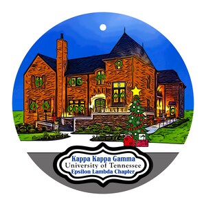 May include: A round Christmas ornament featuring a brick house with wreaths and a Christmas tree. The ornament has the text "Kappa Kappa Gamma University of Tennessee Epsilon Lambda Chapter". The background is a blue night sky.