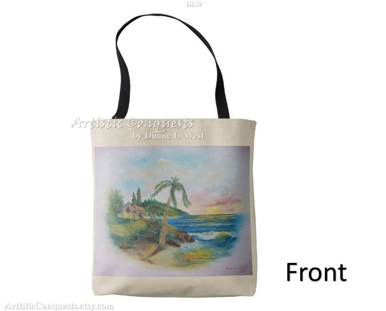 May include: A white tote bag with black handles features a painting of a beach scene with a palm tree, a small house, and a blue ocean. The text "Artistic Conquests by Dianne L. West" is printed on the bag.